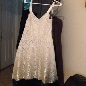 Is beige with gold in the bottom